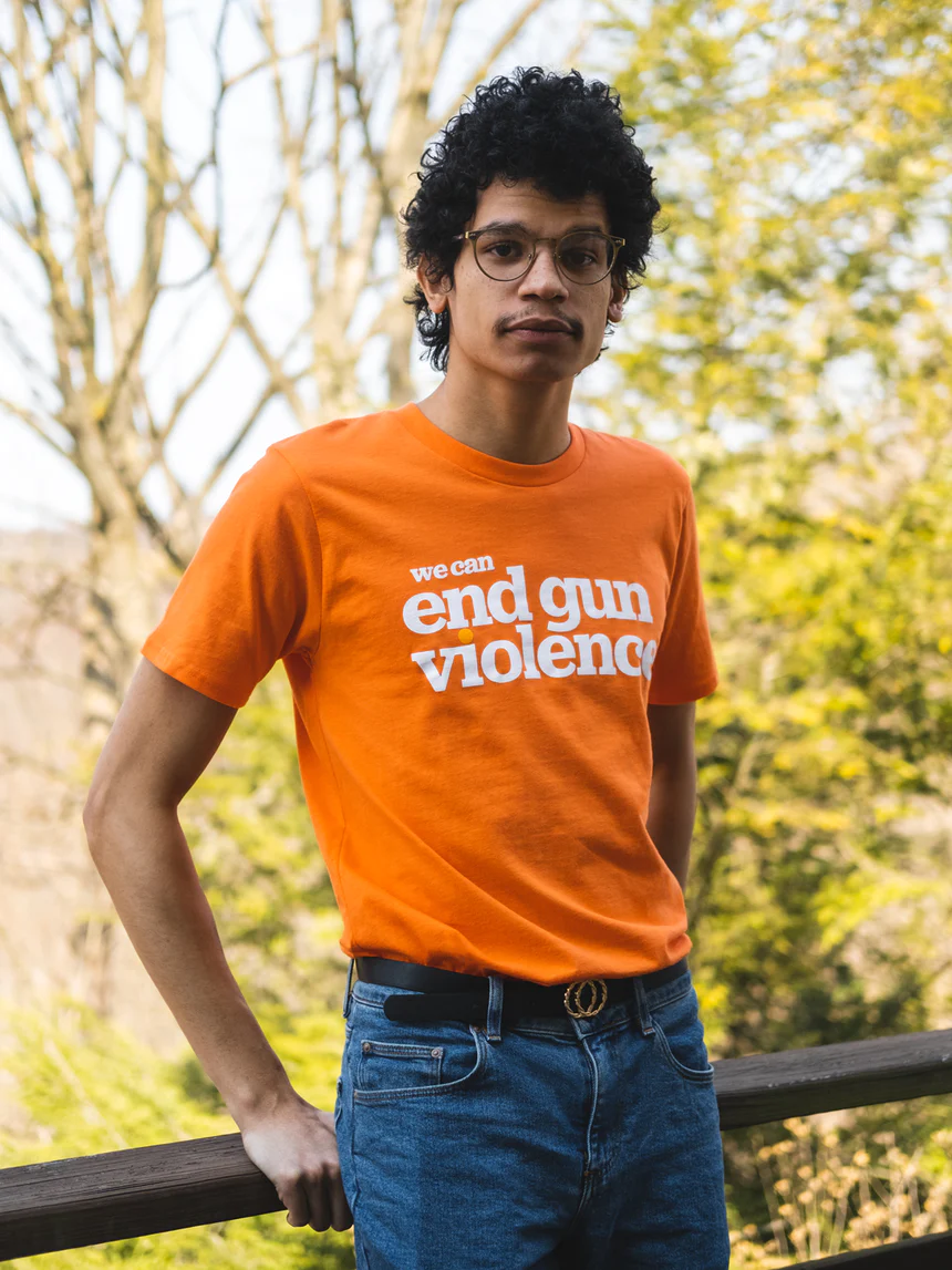A person wearing the Wear Orange End Gun Violence Tee